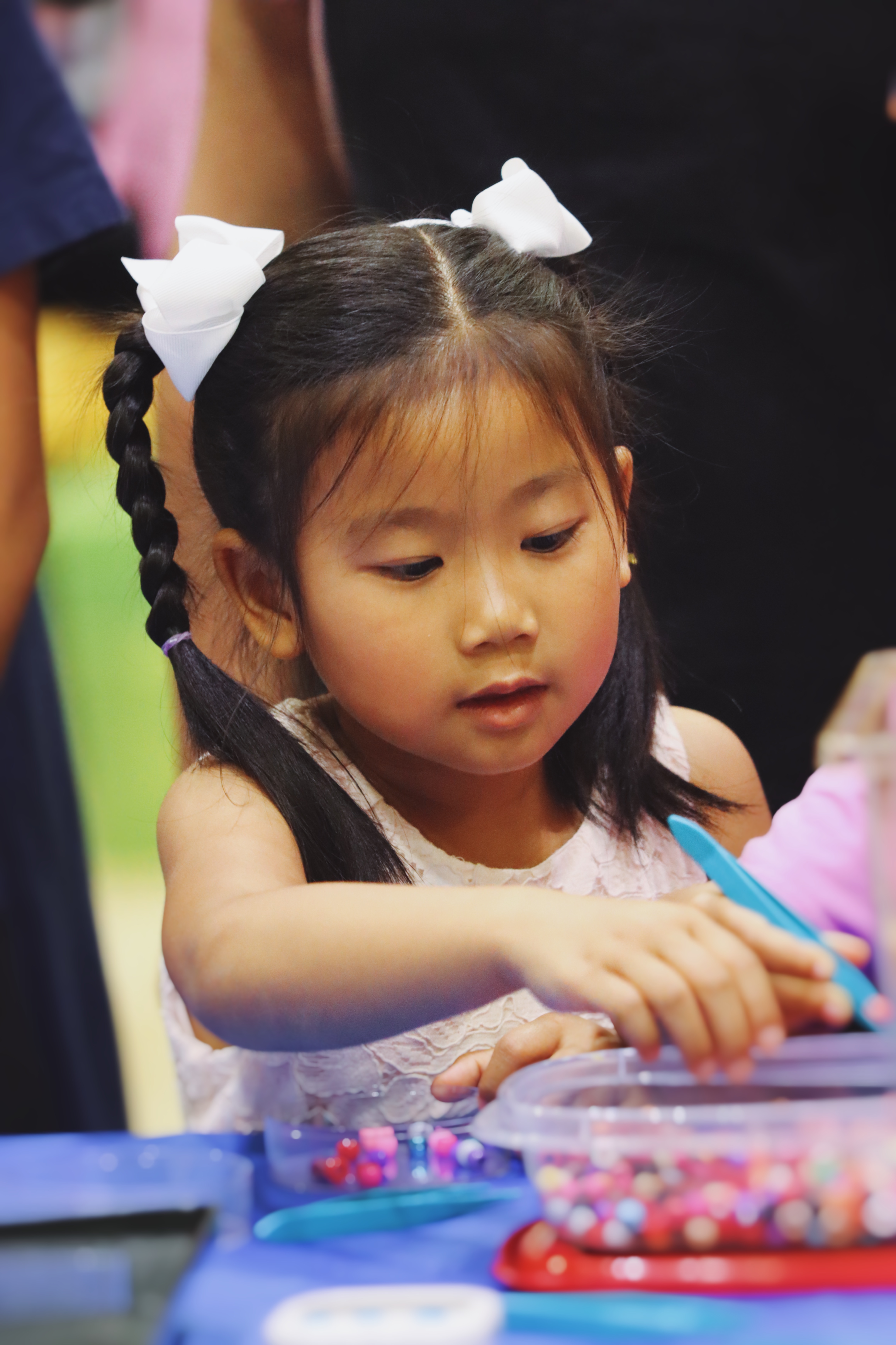 Girl sorting beads