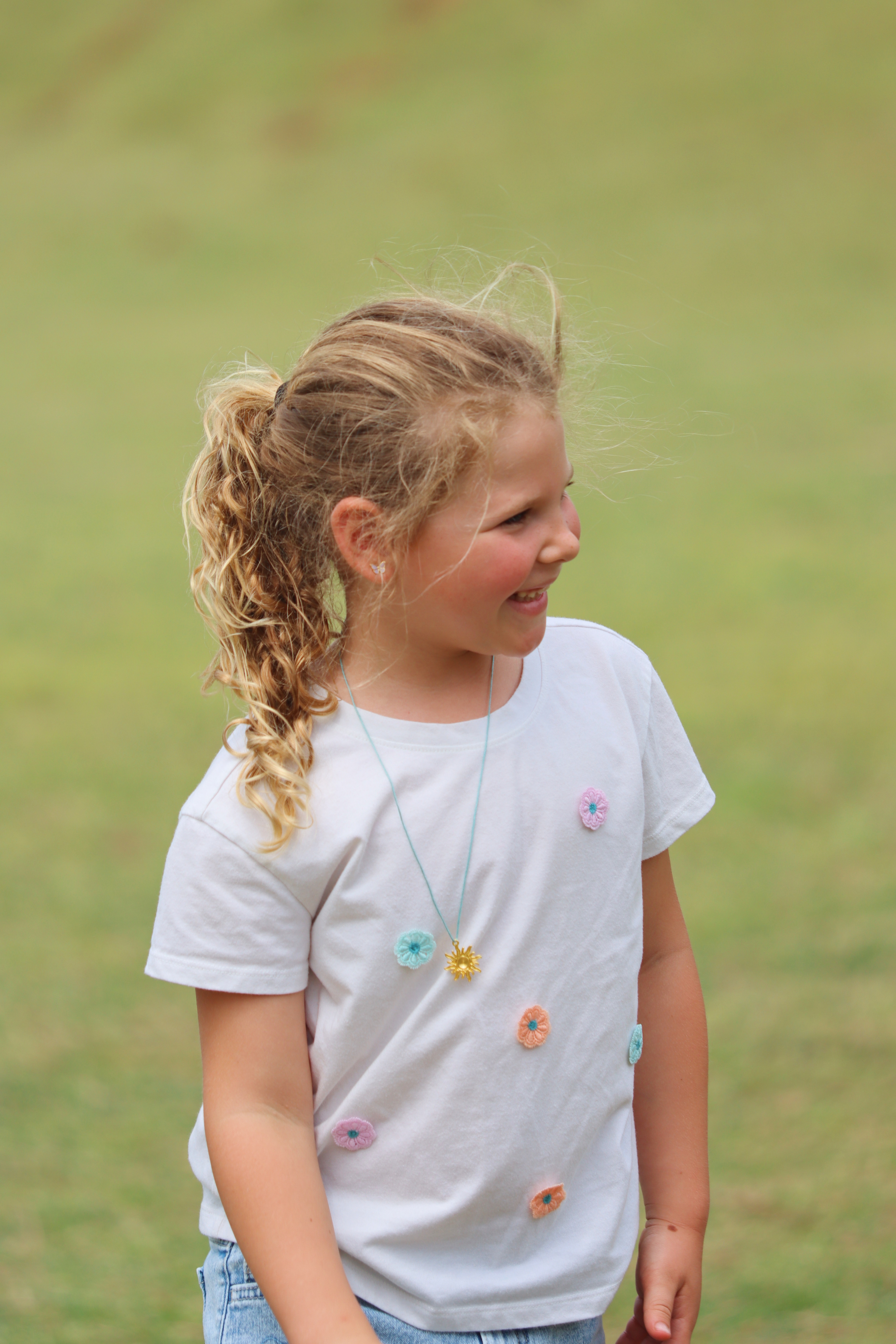 Girl laughing outdoors
