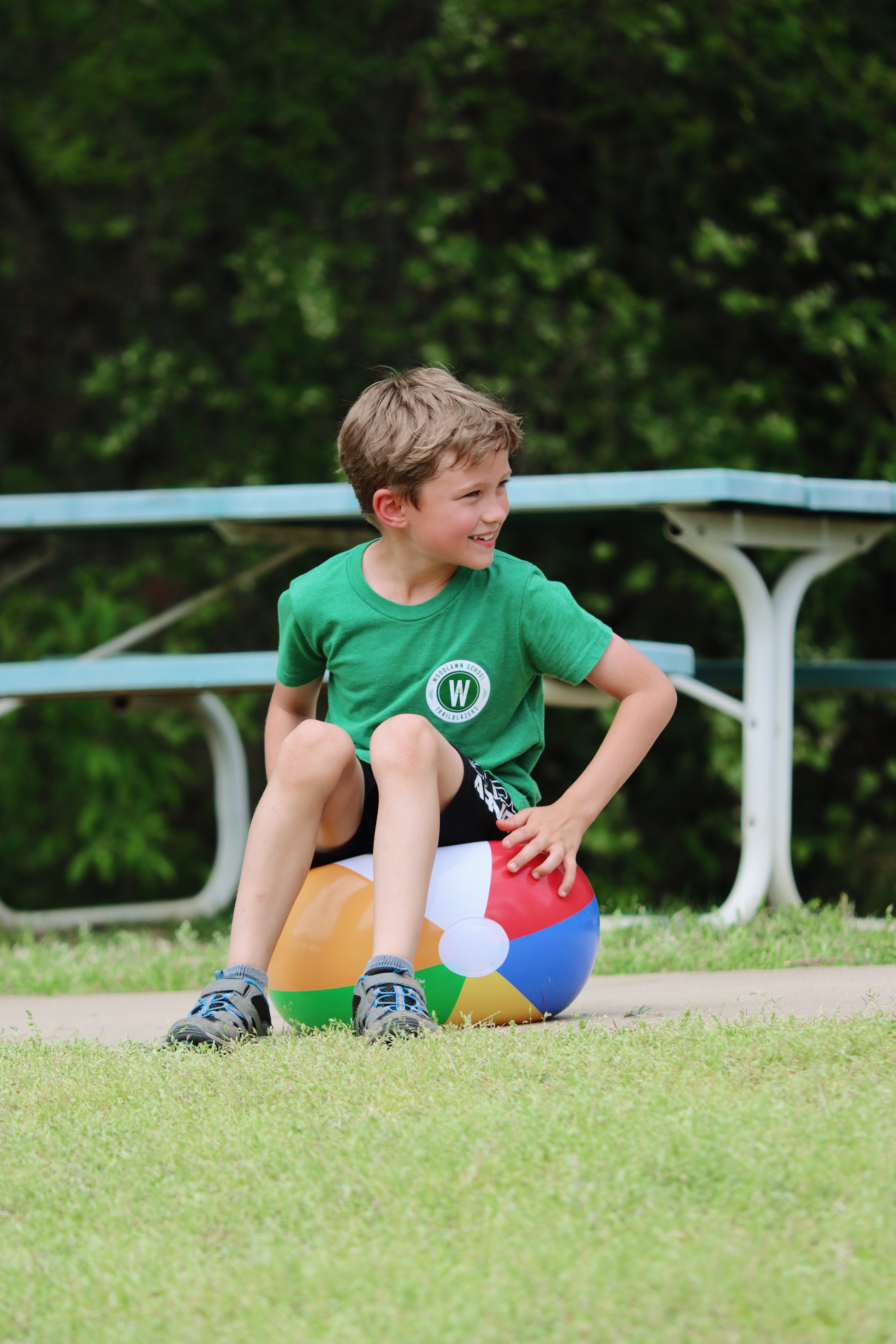 Boy on beach ball
